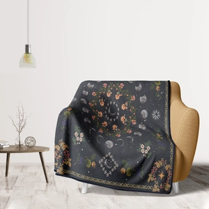 Bohemian moon phase flannel blanket on yellow sofa for living room or office decor