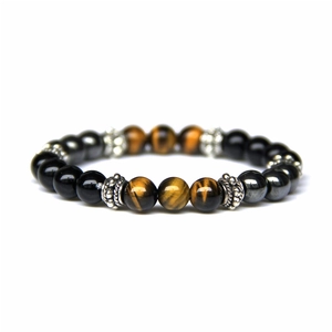 Natural tiger eye and black stone beaded bracelet with silver metal spacers on white background