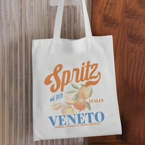 Detailed close-up of white canvas tote bag featuring vintage Spritz Veneto graphic print