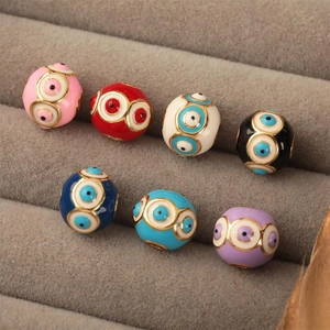Macro detail of colorful evil eye beads in seven colors for DIY jewelry making and crafts