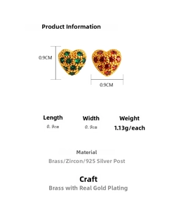 Detailed specs of heart-shaped brass earrings with green zircon and 925 silver pins