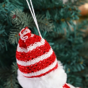 Charming red and white striped knitted Christmas tree ornament with plush faux fur trim