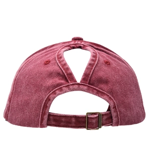 Detail of washed cotton ponytail cap with criss-cross elastic bands and metal buckle