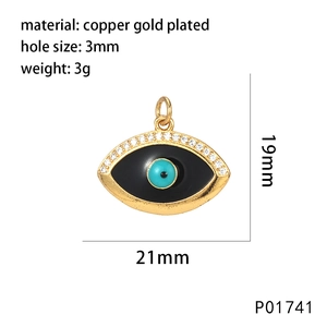 Macro detail of gold plated Evil Eye charm with 21mm x 19mm dimensions and 3mm hole size