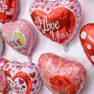 Detailed cluster of colorful heart-shaped foil balloons with I Love You print and floral patterns