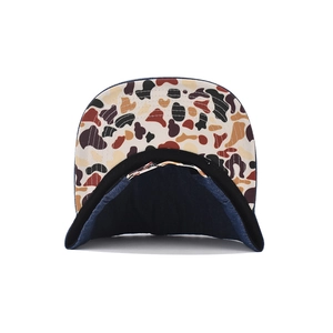 Detail of navy denim baseball cap with camouflage under-brim and metal buckle closure