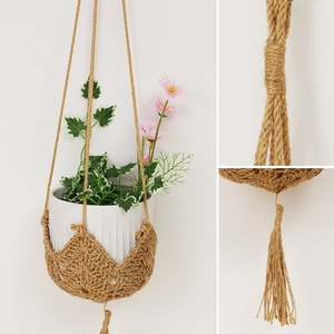 Handmade macrame plant hanger with bohemian fringe for indoor and outdoor wall decoration