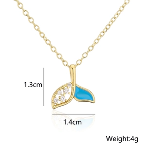 Detail of 18K gold whale tail pendant with blue enamel and zircon, weight 4g and size 1.3cm