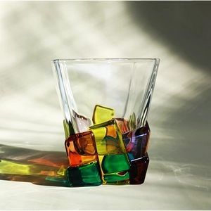 Detailed view of hand-painted colorful geometric crystal glass with natural lighting effects