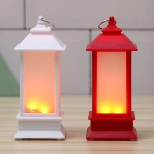 Detail of red and white vintage LED lanterns featuring candle-like warm glow and hanging ring