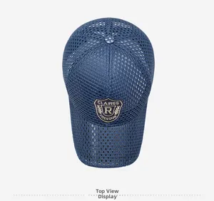 Top view of a blue breathable mesh baseball cap with embroidered shield patch detail