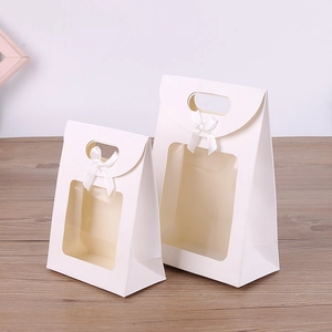 White kraft paper gift bags with clear window and silk bow in two versatile sizes