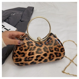 Detail of leopard print evening box bag with gold metal handle and chain strap