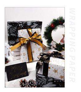Close-up of premium Christmas wrapping paper with star patterns and festive ribbons