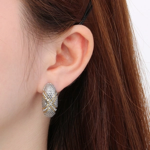 Minimalist oval stainless steel stud earrings with textured relief in gold and silver