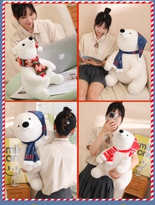 Detail view of plush polar bears in two sizes wearing colorful knit Christmas scarves