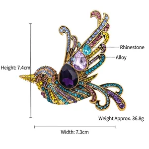 Vintage style bird brooch with colorful rhinestones on a gold-tone alloy base