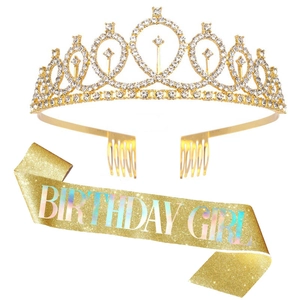 Detail of a sparkling gold rhinestone crown and glittery Birthday Girl shoulder sash