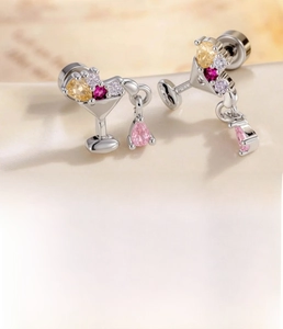 Detail of cocktail glass stud earring with colorful zircon drops and steel post