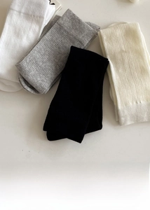 Detailed knit texture of cotton calf socks in white, grey, black and beige colors