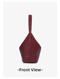 Macro detail of dark red woven leather texture and side structure on crescent bag