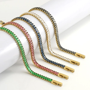 Detail of colorful rectangular zircon tennis bracelets in gold plating with safety clasp