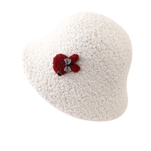 White faux fur bucket hat with cute rabbit patch and checkered bow for winter