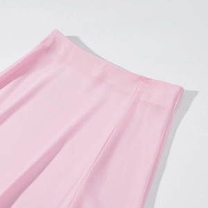 Detailed view of pink skirt elastic waistband sewing and high-quality fabric texture