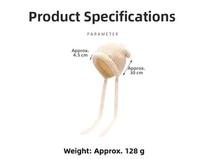 Detail view of cream knit beanie with ear flaps and straps showing 128g weight