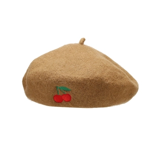 Brown wool beret hat with red cherry embroidery detail on minimalist white background