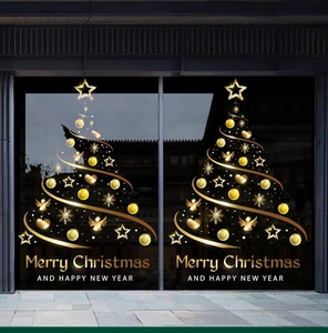 Detail of golden Christmas tree window sticker with stars and Merry Christmas text