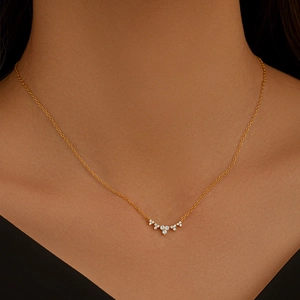 Elegant S925 sterling silver gold necklace with sparkling small stones worn by a model