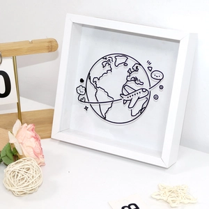 Modern white memory frame for travel tickets featuring a 3D line art map and airplane