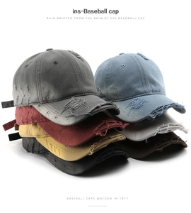 Detailed close-up of distressed baseball caps in various colors with vintage washed texture