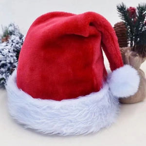 Close-up of a classic red plush Christmas hat with a thick white faux fur trim and pom-pom
