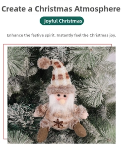 Close-up of a handmade Santa plush ornament hanging on a snowy Christmas tree branch