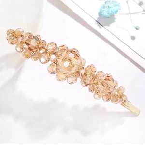Elegant Korean style crystal hair clip with amber beaded design on a gold metal barrette