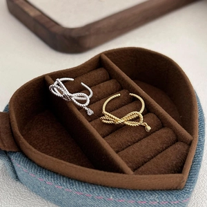 Elegant 925 sterling silver bow rings in gold and silver finish on velvet box