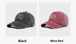 Detail view of washed cotton baseball caps with DAD and MOM embroidery in black and wine red