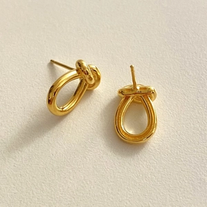 Minimalist 925 sterling silver knot stud earrings with a polished gold finish for women