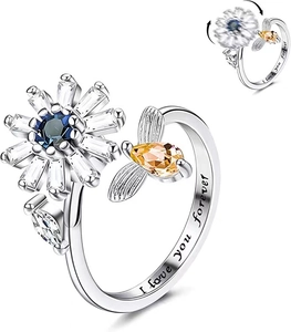 Detail of spinning daisy ring with bee, engraved I love you forever for anxiety relief