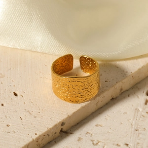 Wide gold textured stainless steel C-shape open ring with irregular hammered finish