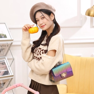 Gradient woven pattern crossbody bag with gold chain strap and turn-lock closure