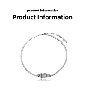 Detail view of silver snake chain necklace featuring a vintage industrial buckle pendant