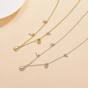 S925 silver necklace with key and lock charms, featuring zircon in gold and silver finish