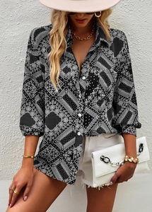 Detail of long sleeve paisley print shirt featuring button-down front and hibiscus linen fabric