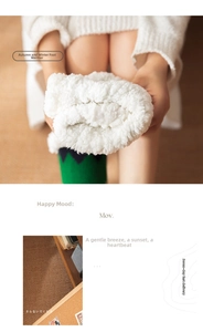 Close-up of thick white sherpa fleece floor socks with green wavy patterns for winter