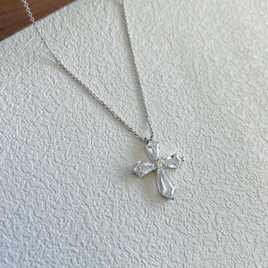 Detailed view of S925 sterling silver cross pendant with sparkling clear zircons