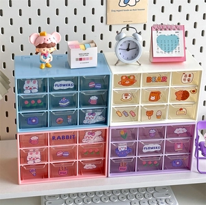 Detailed view of stackable desktop organizer with transparent nine-grid drawers and stickers