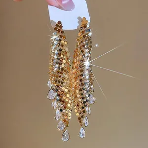 Elegant gold plated long drop earrings with metallic sequins and crystal teardrops